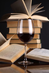 Wine glass and books