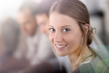 Portrait of beautiful blond girl in class