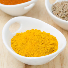 turmeric in a bowl, closeup