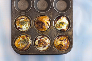 Freshly baked paleo muffins in a pan, overhead view 