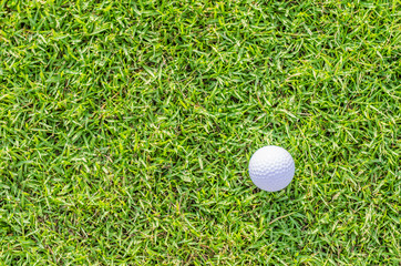 Golf ball on green grass