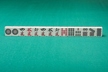 Smooth table surface with a mahjong on it