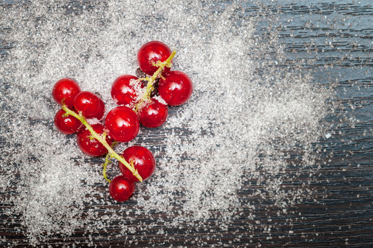 Red currant berries sprinkled with sugar