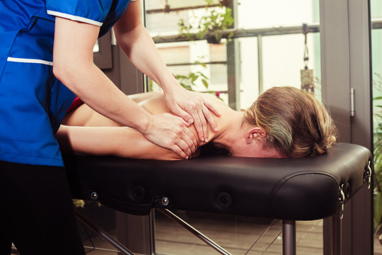Woman being massaged on a table