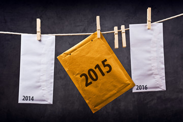 Three Envelopes with year numbers on clothes rope
