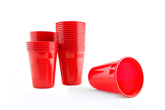 Plastic red cups on white background