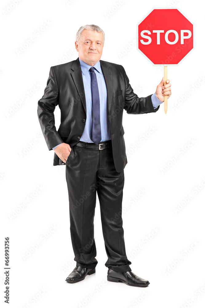 Sticker mature businessman holding a stop sign