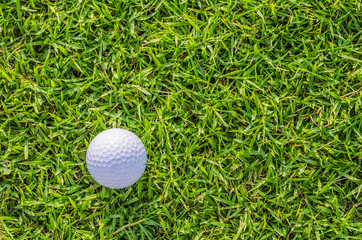 Golf ball on green grass