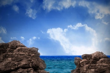 Fototapeta na wymiar Large rocks overlooking sea and sky