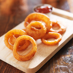 onion rings on wood board