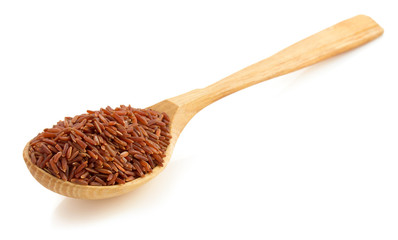 rice in wooden spoon on white