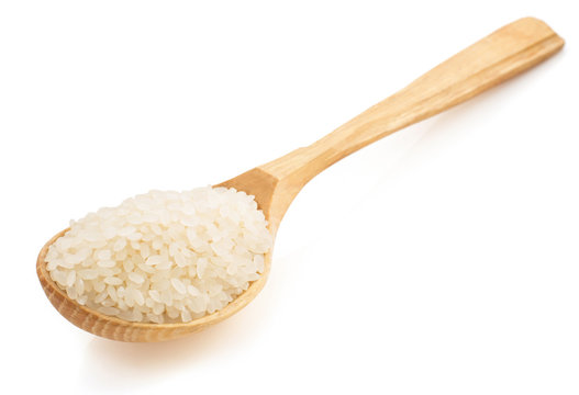 Rice In Wooden Spoon On White