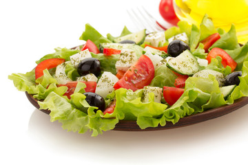 salad in plate on white