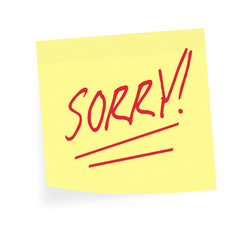 Sorry note.  Apology on sticky. White background.