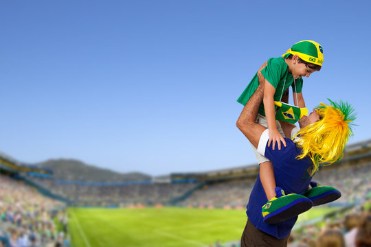 Brazilian fan at stadium with son