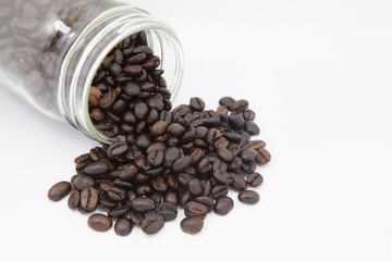 coffee beans in bottle on white background