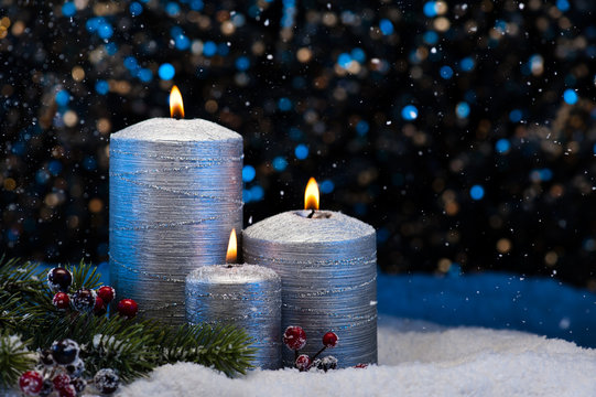 Three Silver Candles in snow