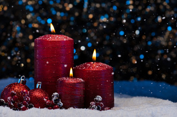 Three Red Candles in snow