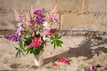 Fototapeta na wymiar still life bouquet with lupines