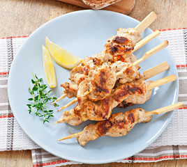 grilled chicken on bamboo skewers