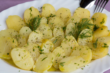 Delicious boiled potatoes with dill and olive