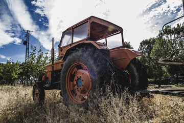 vehicle, old agricultural tractor abandoned in a farm field