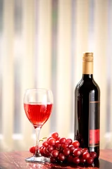 Fotobehang Red vine in glass, grapes and bottle of vine. © Andrzej Sowa