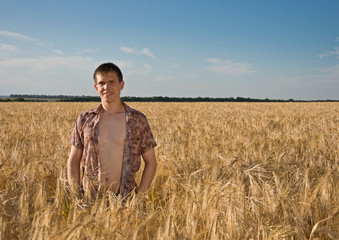 Naklejka na ściany i meble farmer in the wheat field