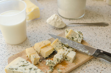 Blue cheese cutted on wooden plate
