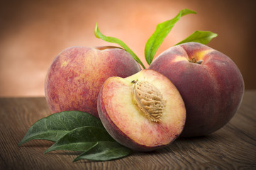 Fresh peach sliced close up on the table