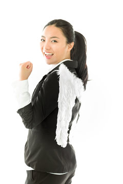 Asian young businesswoman dressed up as white angel looking