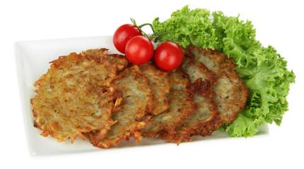 Potato pancakes on plate, isolated on white