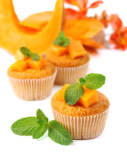 Tasty pumpkin muffins, isolated on white