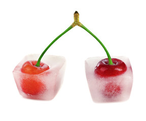 Cherry in ice cube isolated on white
