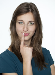 Naklejka premium Young women with finger on lips