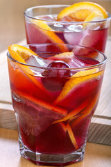 Ice refreshing summer drink with lots of different fruits