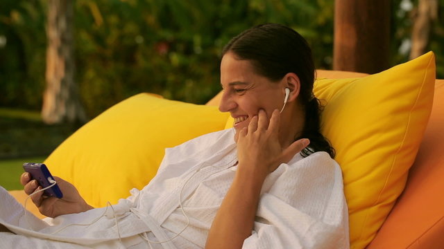 Woman Watching Funny Film On Smartphone In The Garden