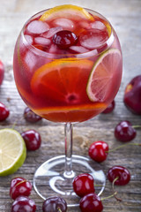 Ice refreshing summer drink with lots of different fruits