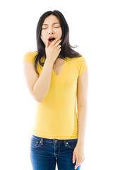 Young Asian woman yawning isolated over white background