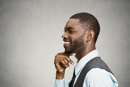 Side view headshot happy, smiling daydreaming businessman