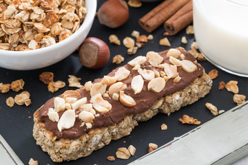 oat bar with chocolate and nuts, close-up