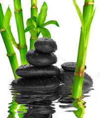 spa Background -  black stones and bamboo on water