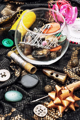 thread,button,crochet hook, and other sewing tools