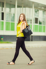 Young attractive woman with bag