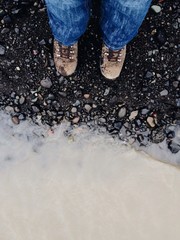 Hiker feet with boots in a glacier edge