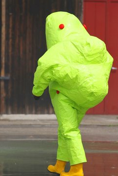man with the yellow suit and breathing apparatus to enter contam