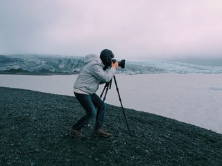 Photographer with a tripod in Skaftafell glacier, Iceland