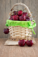 Cherries on wooden table and cherry juice