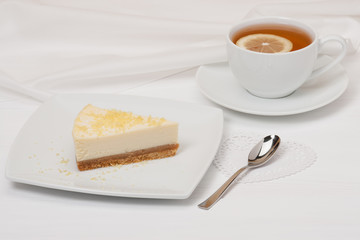 Cheese Cake With Lemon Zest. Tea With Lemon Slice