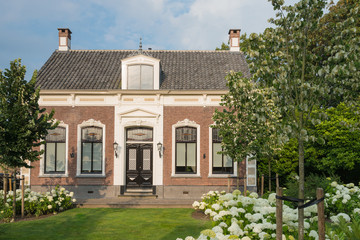 Fototapeta na wymiar Old Dutch house with front yard